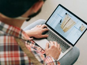 Person working on a design on a laptop